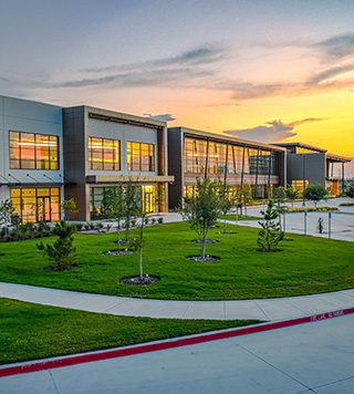 Image of a corporate campus at sunset. 