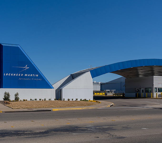 The image includes the main sign and entrance for Lockheed Martin Air Force Base.